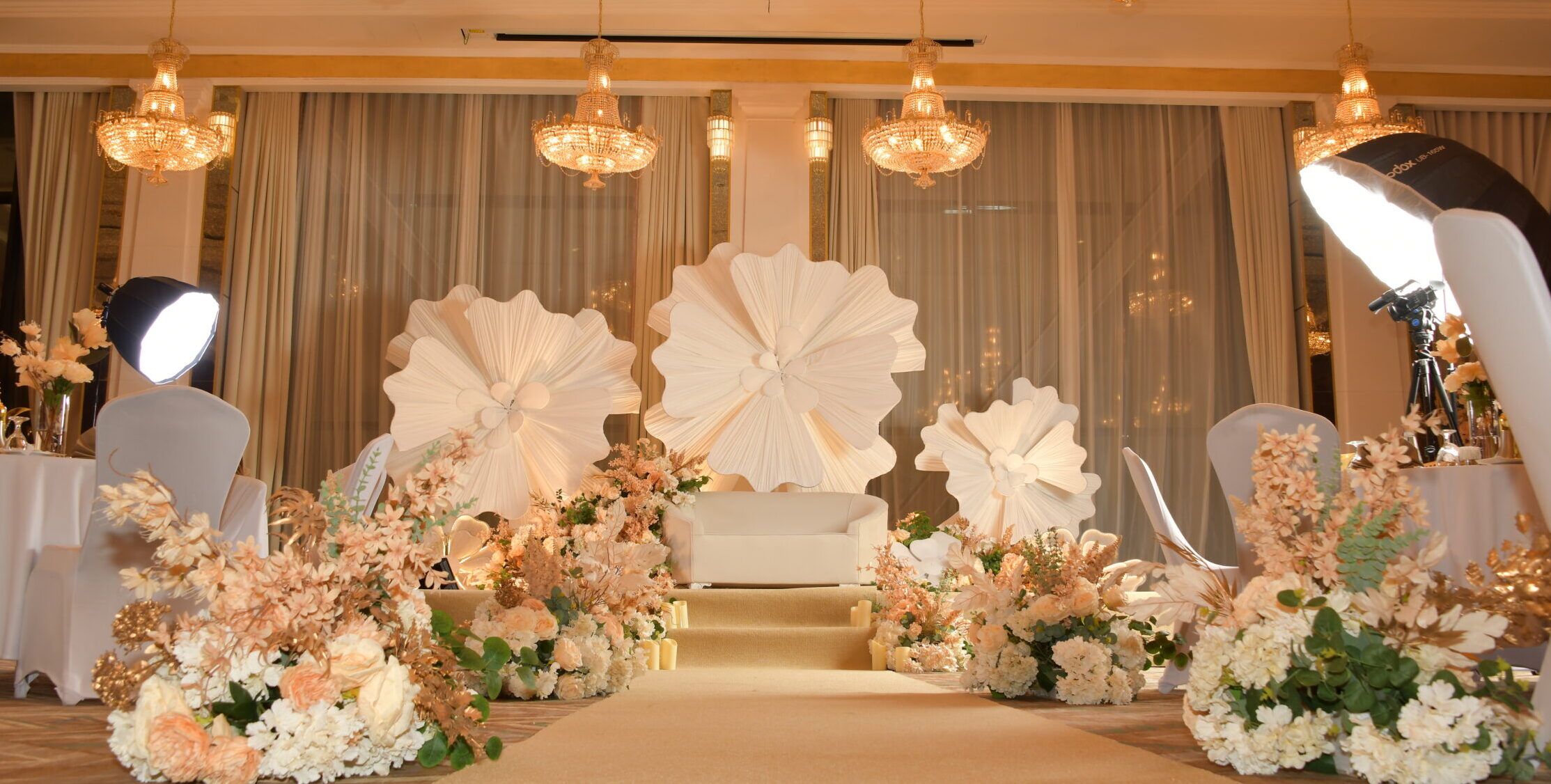 Luxury floral Kosha stage in a 5-star Madinah ballroom by Vibrant Vows